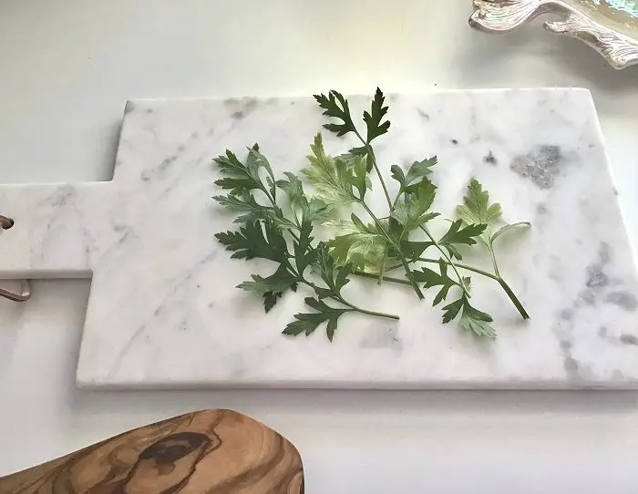 Fresh Parsley Herbs On Marble Cutting Board