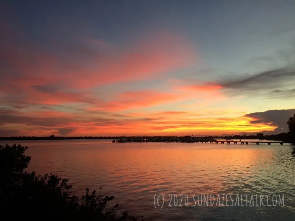 Gorgeous Late Summer September Coral Sky Sunset View Overlooking The Water And Dock