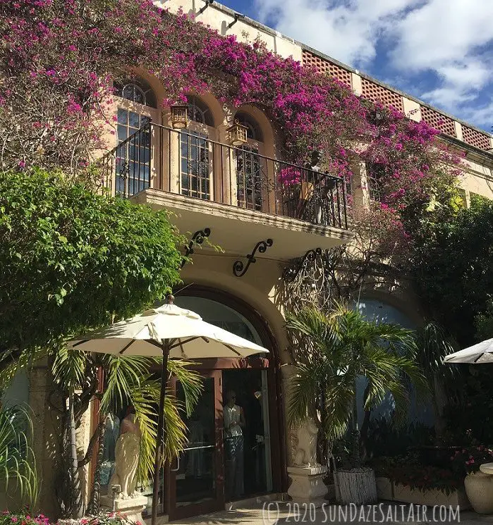 Purple Bougainvillea Covering Front Of Building Around Juliette Balcony