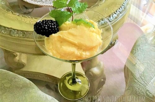 Lemon Custard Pudding Cake In Martini Glass With Berries And Mint