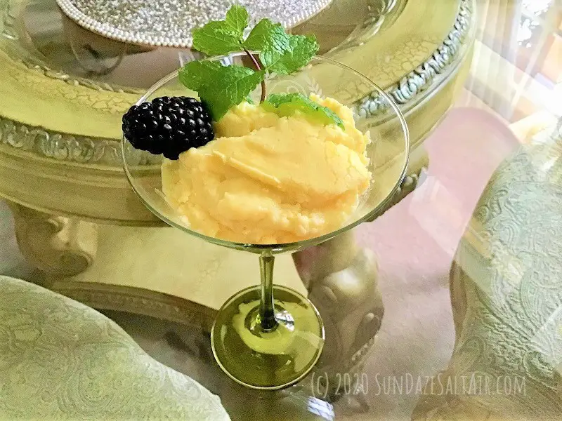 Lemon Custard Pudding Cake In Martini Glass With Berries And Mint