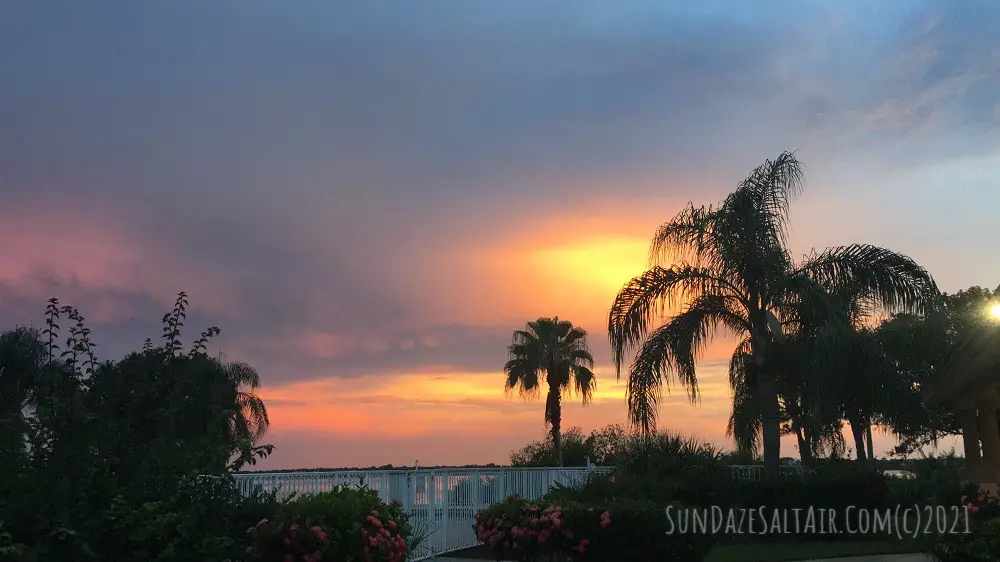 Palms Overlook Purple & Coral Winter Sunset Over Pool & River In The Tropics