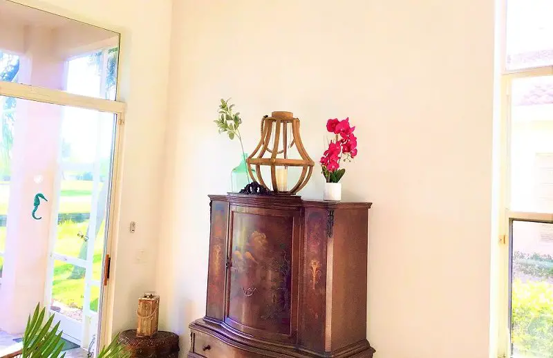 Make High Ceilings Look Cozier by adding lanterns & tall plants to help fill up vertical space