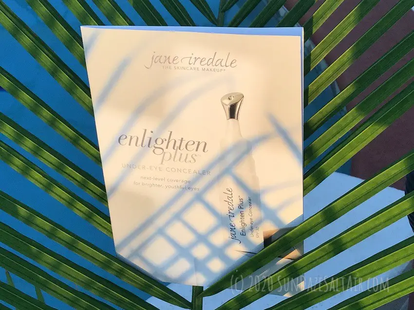 Jane Iredale Enlighten Plus Under-Eye Concealer Review & First Impression - Concealer sample displayed in the sunset glow between palm fronds