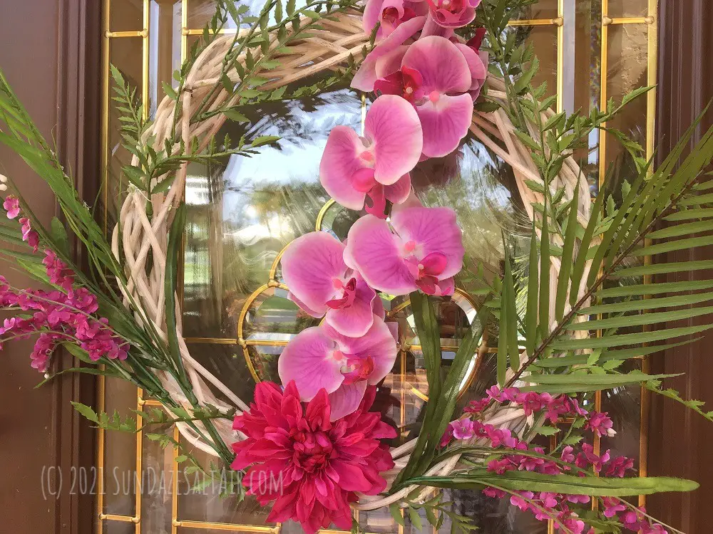 How to make a tropical wreath using palm fronds, ferns, orchids & other flora - the beautiful, finished wreath after its tropical island makeover