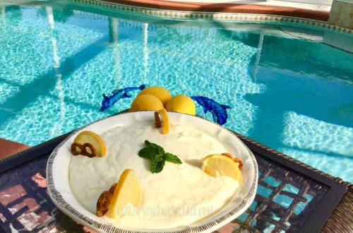 Delicious No Bake Lemon Ricotta Icebox Crunch pie with a pretzel crust overlooking the pool and dolphins