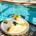 Delicious No Bake Lemon Ricotta Icebox Crunch pie with a pretzel crust overlooking the pool and dolphins