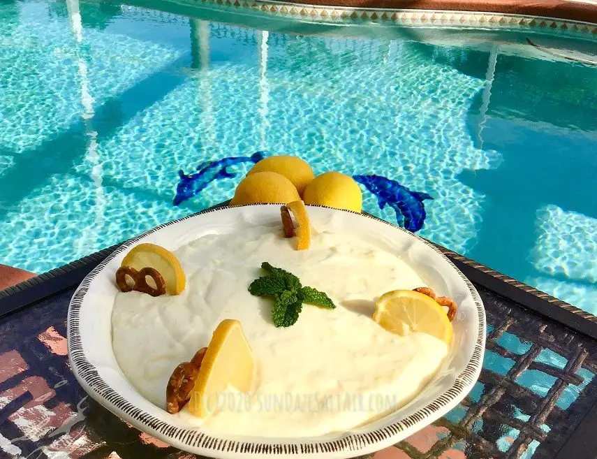 Delicious No Bake Lemon Ricotta Icebox Crunch pie with a pretzel crust overlooking the pool and dolphins