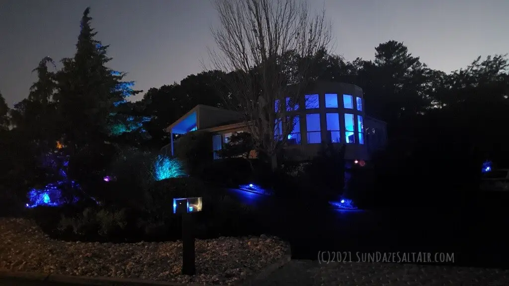 Best Colorful Landscape Lighting Ideas Plus Advantages Of Outdoor LED & Solar Color Changing Lights To Illuminate Your Landscape - Postmodern house appears even more stately lit up in a combination of royal blue LED & solar lights