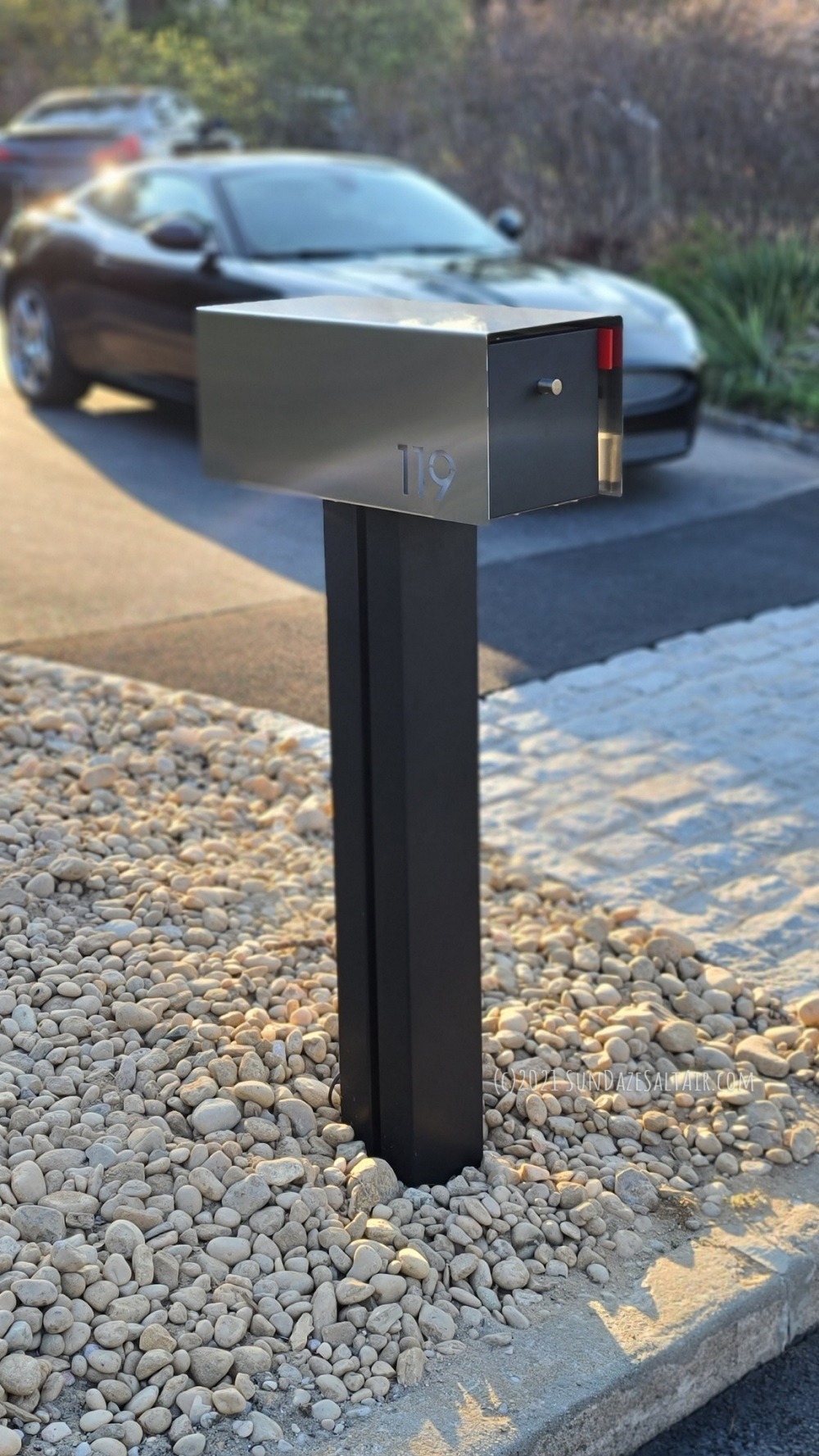 The best colorful landscape lighting ideas include highlighting property features you wish to stand out like this sleek, contemporary mailbox