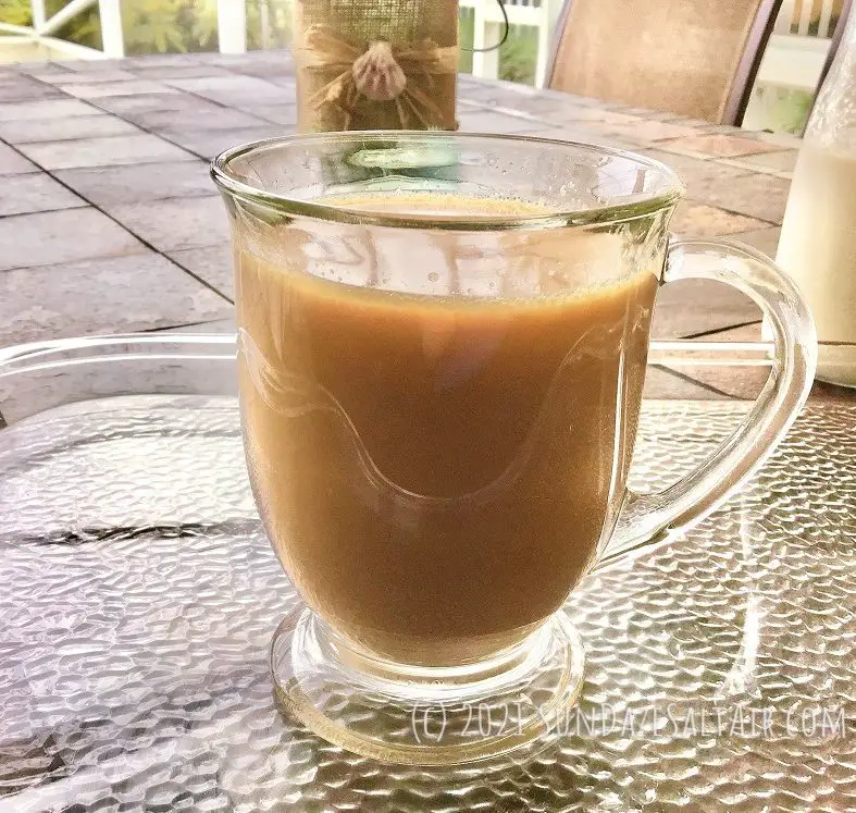 Best Healthy Homemade Coffee Creamer Made Naturally_Easy, Delicious, No Trans Fats Added to Coffee In Glass Mug On Textured Glass Tray Ready To Be Served