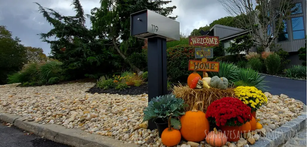 October Garden Chores_Essential Fall Tasks In Your Garden To Savor The Season_Add hay bales, gourds, mums & pumpkins plus a harvest sign next to your mailbox