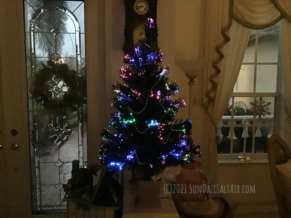Decorate-a-room-with-high-ceilings-for-Christmas-with-small-Fiber-optic-trees-on-ledges-&-table-tops