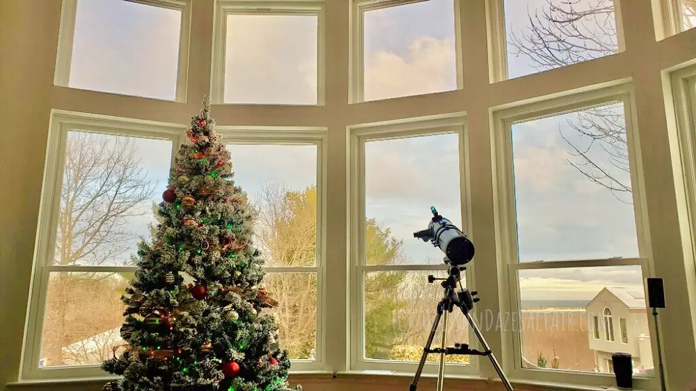 How To Decorate A Room With High Ceilings For Christmas--Flocked Christmas Tree Overlooks Picture Window Panoramic View Of Bay In Winter