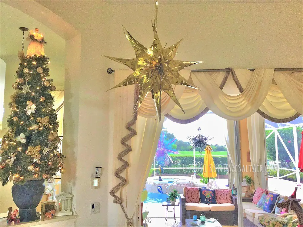 How To Decorate A Room With High Ceilings For Christmas-Hang stars & snowflakes from ceilings or on windows