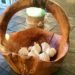 How To Grow Your Own Garlic This Winter For Amazing Flavor & Health Benefits-Garlic bulbs in rustic wood basket on table
