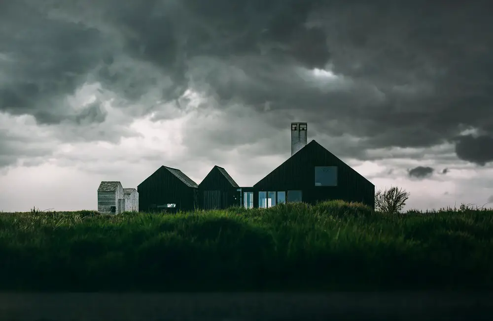 Reduce costs of your homeowners insurance & also reduce your risk before storm season rolls around... ominous storm clouds threaten home